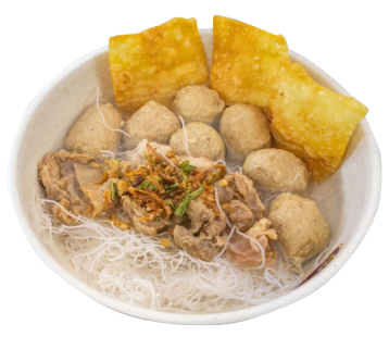 A bowl of bakso beehoon with meatballs and fried wontons